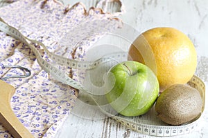 Lose weight to clothes concept with dress and fruits diet