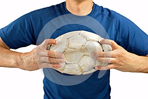 Football player is breaking the ball