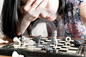 The loser women sad after fighting the chess, committed, competition, winner, successful, dedicate concept photo