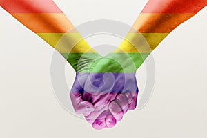 loseup of a gay couple holding hands, patterned as the rainbow flag
