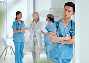 Losing a patient isnt just part of a job. Shot of a medical practitioner looking stressed in the middle of a meeting in