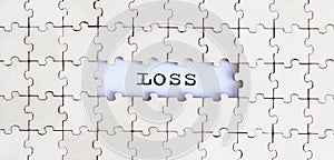 LOSS .Business concept. White puzzle pieces with different phrases on the white background, top view