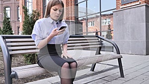 Loss, Frustrated Woman using Smartphone Outside Office