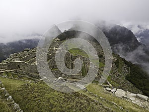 The Lost City Of The Incas On Machu Picchu. Low Clouds Covering Huayna Picchu, Peru