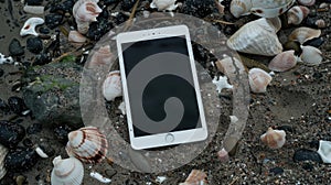 Lost Connection: Cell Phone Surrounded by Seashells