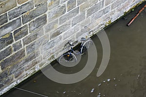 Lost degrading bike on the bottom of Regnitz River, Bamberg, Bavaria, Germany. November 2014