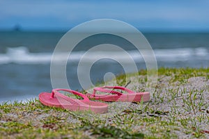 Lost footwear in sanddunes at beach. photo