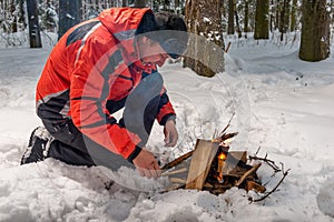 A lost frozen tourist tries to build a fire