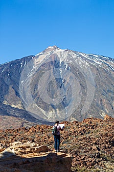 Lost hiker checks map to find directions