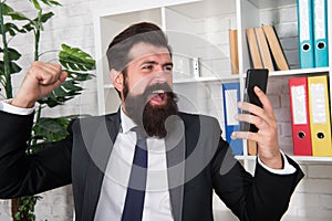 Lost his temper. Angry broker punch smartphone. Bearded man got angry with sms information. De-stressing method. Stress