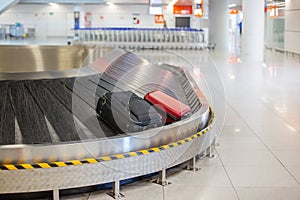 Lost luggage at the airport. Baggage sorting - Luggage on conveyor