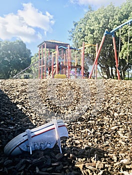 Lost shoe found on playground.