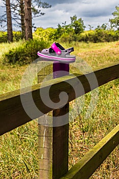 Lost shoe left on fence post