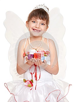 Lost tooth child dressed as tooth fairy with gifts