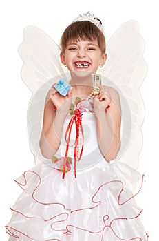 Lost tooth child dressed as tooth fairy with gifts and money