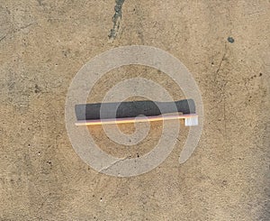 Lost Toothbrush on Concrete Ground