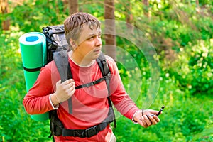 Lost tourist in a hike with compass