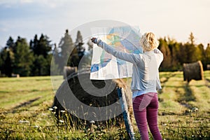 Lost Woman on a Rural Scene Looking at a Map