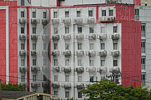 A lot of Air conditioner aircon in a condominium building photo