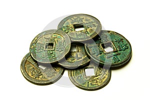 Ancient Chinese bronze coins on white background