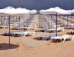 A lot of beach umbrellas and sun beds