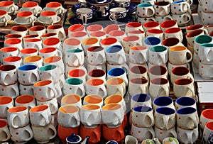 Lot of Beautiful Colorful Crockery Mugs outdoors