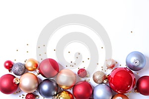 A lot of beautiful decorative Christmas balls on a white background,