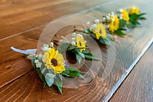 Lot of beautiful pocket flower bouquets made of yellow flowers for a wedding ceremony
