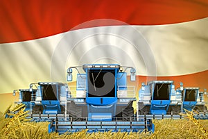 A lot of blue farming combine harvesters on wheat field with Austria flag background - front view, stop starving concept -