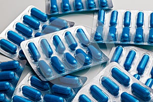 A lot of blue pills in blister packs