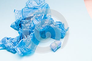 a lot of blue shoe covers on a blue background, copy space, a small bundle of shoe covers
