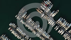 A lot of boats and yachts on the pier in the harbor. Aerial view of Milta marina bay in Bodrum, Turkey