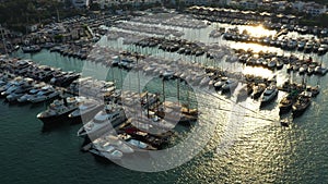 A lot of boats and yachts on the pier in the harbor. Aerial view of Milta marina bay in Bodrum, Turkey