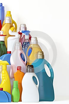 A lot of bottles with chemicals for cleaning. Different plastic bottles in the form of mountain.