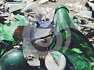 A lot of broken color bottle. Glass background