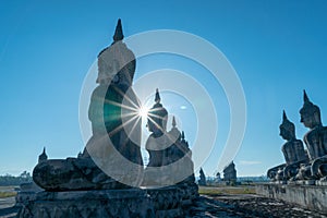 A lot of Buddha statues in blue sky at the large field in Tungsong photo