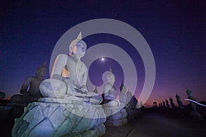 Buddha statues in twilight photo