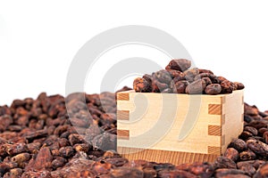 A lot of Cocoa bean in wooden box isolated on white background