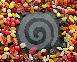 A lot of colorful candy on background, texture