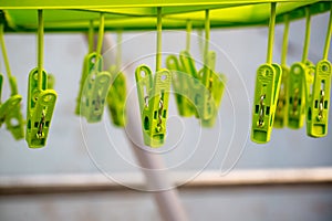 A lot of colorful cloth clips, being wired with wire and blur background. image for background,wallpaper