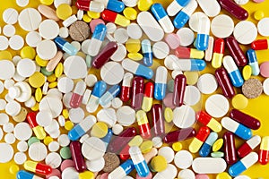 A lot of colorful medication and pills from above. Pharmaceutical industry concept