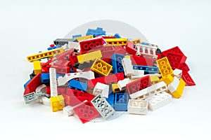 Lot of colorful rainbow toy bricks background. Educational toy, constructor for children Isolated on white background