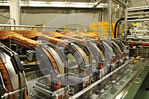 A lot of cookies on the production line. The flow of sweets before packaging. Packing crackers on the machine