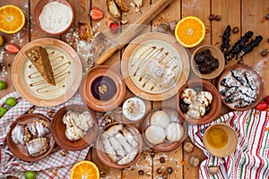 A lot of dessert on the wooden table. Georgian cuisine. Top view. Flat lay . Khinkali and Georgian dishes