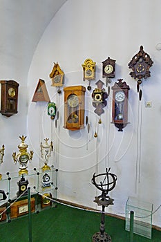 A lot of different and ancient wall clock with cuckoo, very beautiful thing for a vintage interior