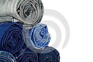 Lot of different jeans isolated on white background