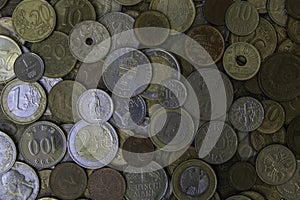 A lot of different metal coins laying on each other