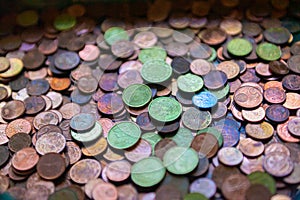 Large group of euro coins in colors in an offertory photo