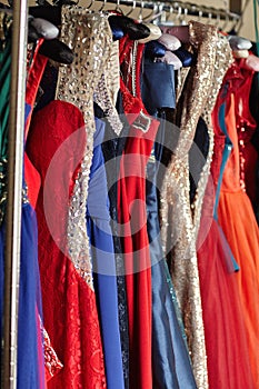 Colorful dresses on hangers