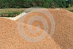 A lot of expanded clay in a pile on the construction site